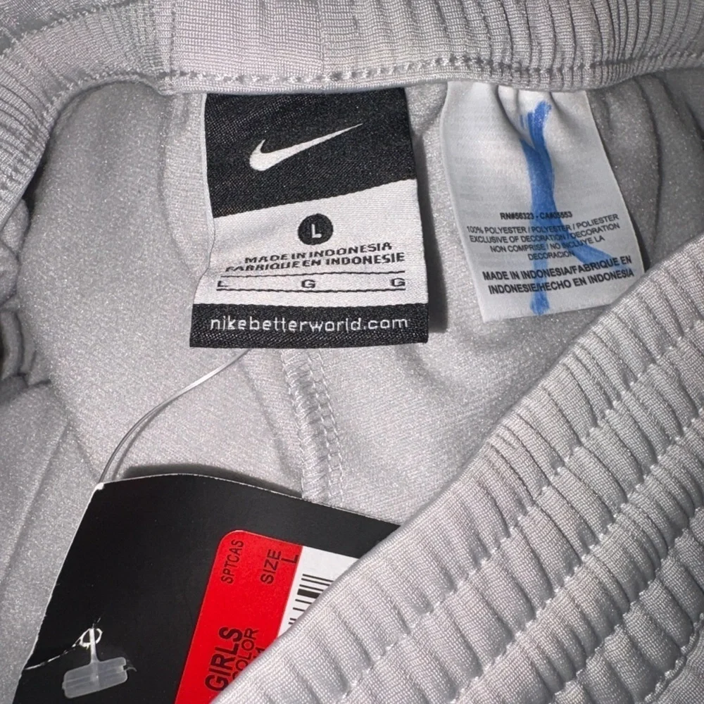 Nike Kids White Joggers with Green and Purple Accents